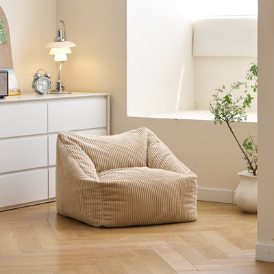 Pouf en velours côtelé beige