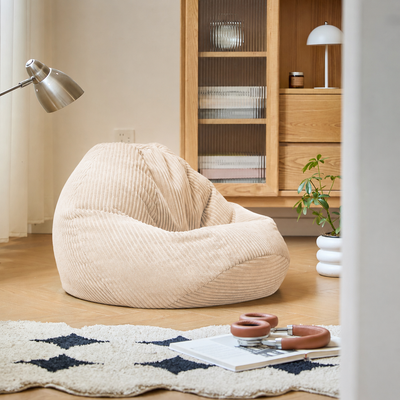 Pouf en velours côtelé beige