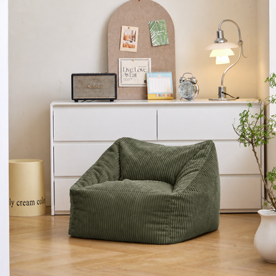 Pouf en velours côtelé vert